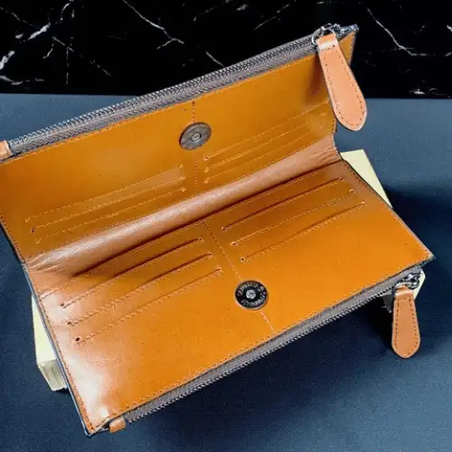 Compact leather wallet for cards and cash.