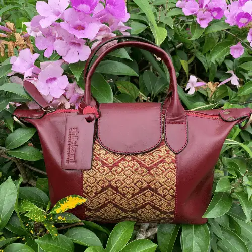 Genuine leather tote bag accented with traditional songket, elegant and unique.